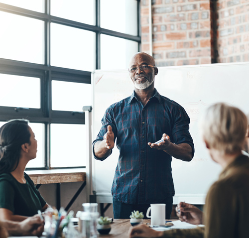 business meeting with diverse participants discussing key ideas and strategies for success in the next 10 days
